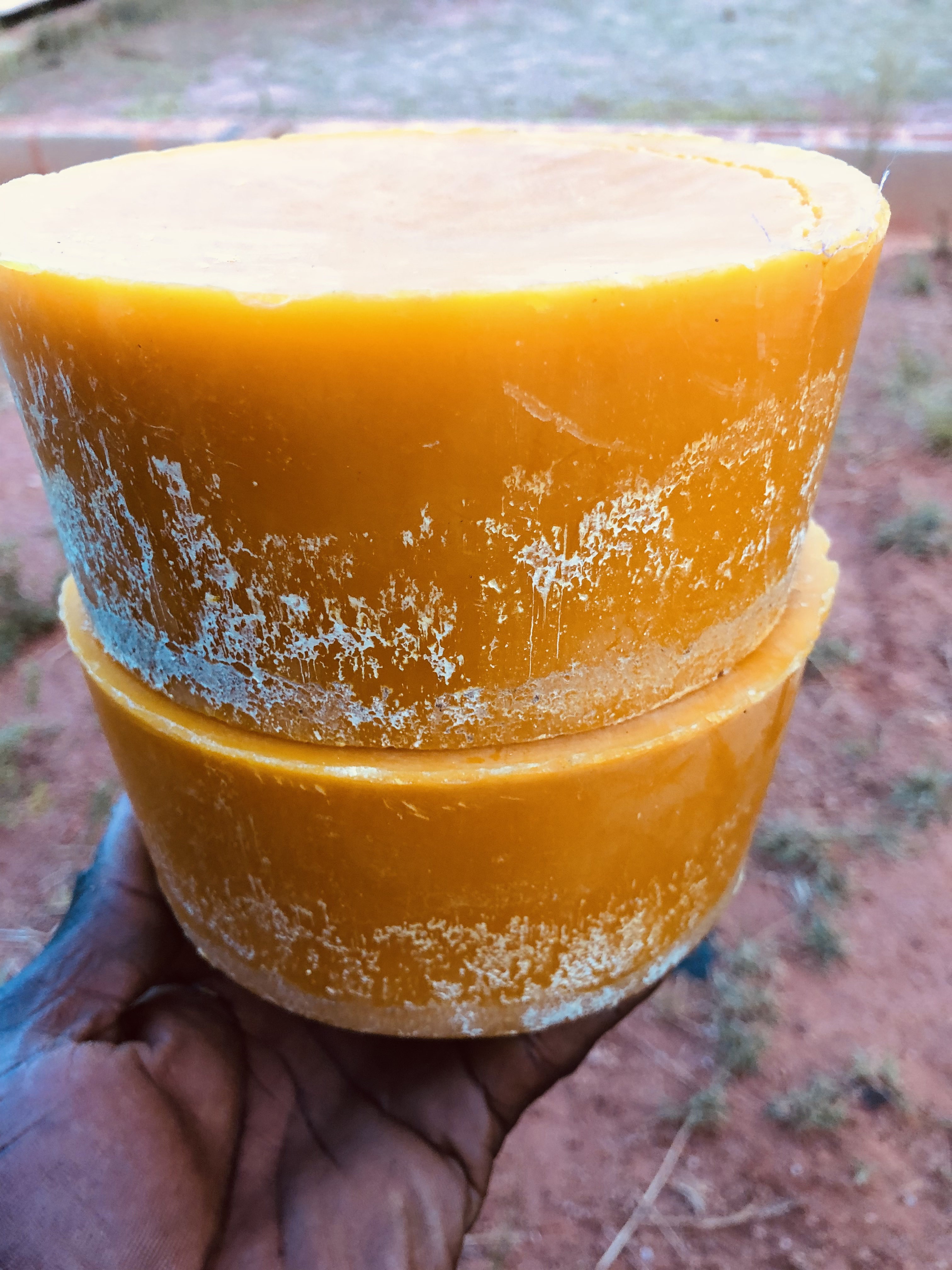 Two stacked blocks of raw beeswax