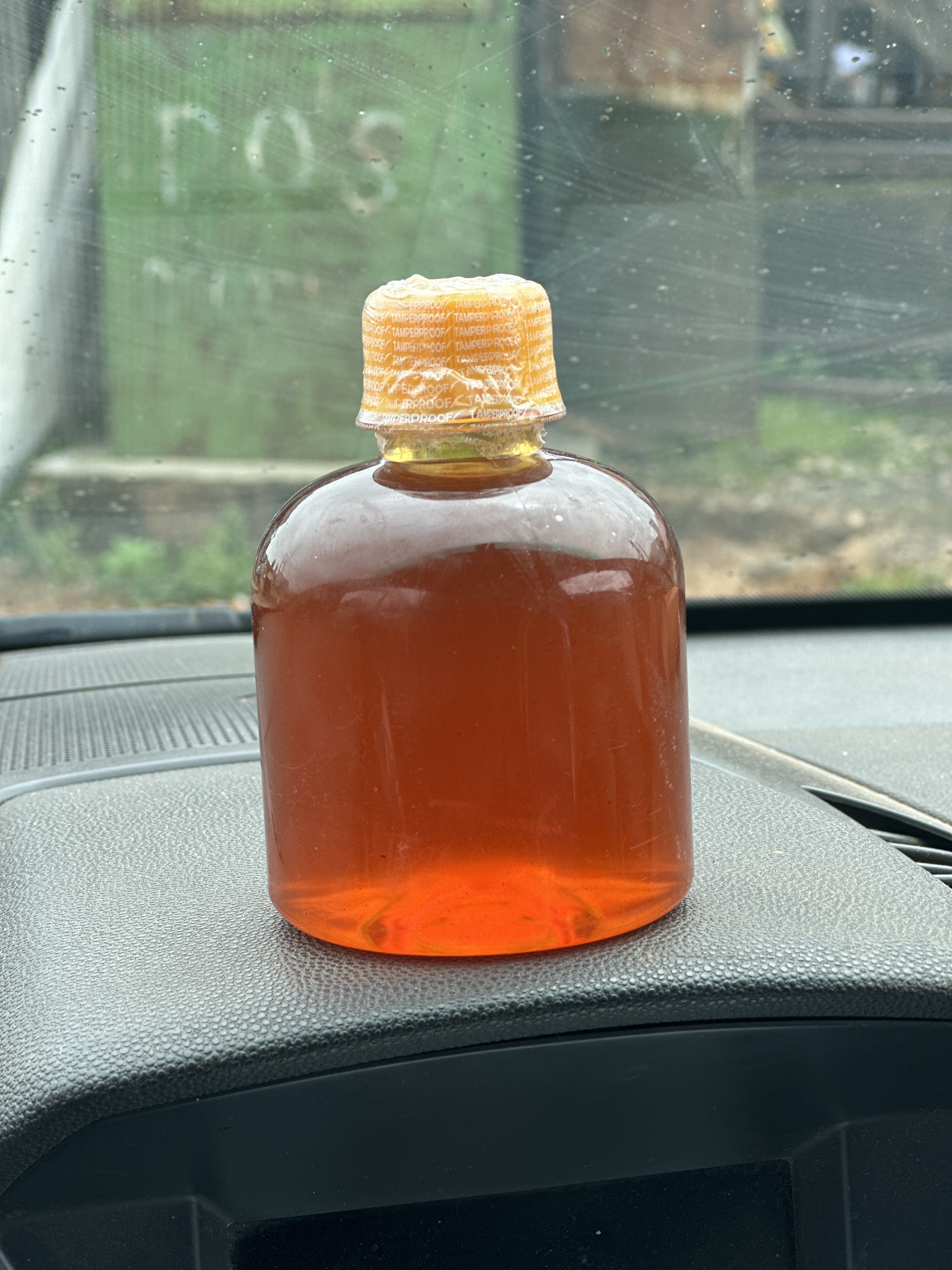 Quarter litre bottle of raw honey